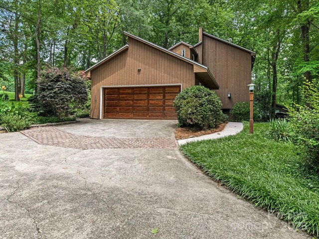 3310 Windbluff Dr, Charlotte, NC 28277 - view of home's exterior with driveway and a garage