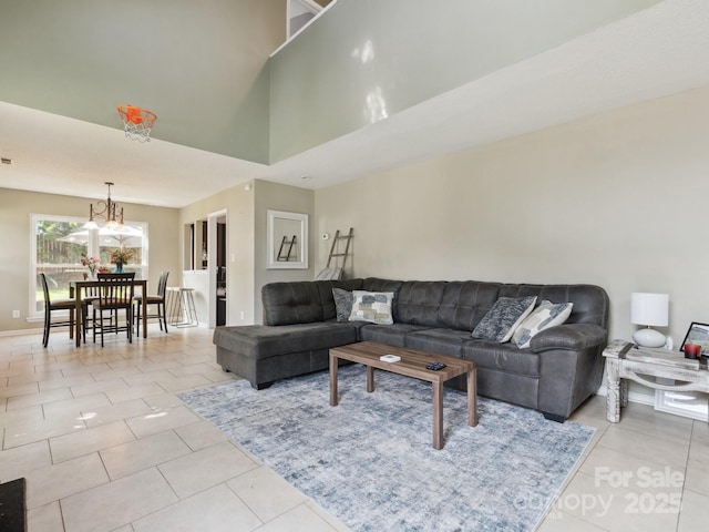 5701 Silver Eagle Dr, Charlotte, NC 28214 - tiled living area with a chandelier and baseboards