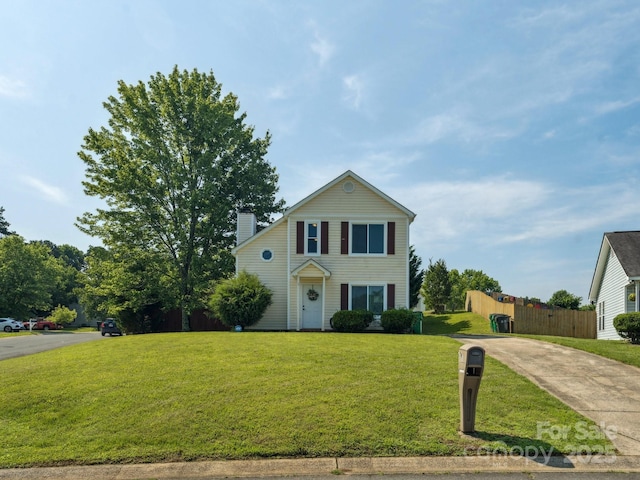 5701 Silver Eagle Dr, Charlotte, NC 28214 - traditional home featuring a chimney and driveway