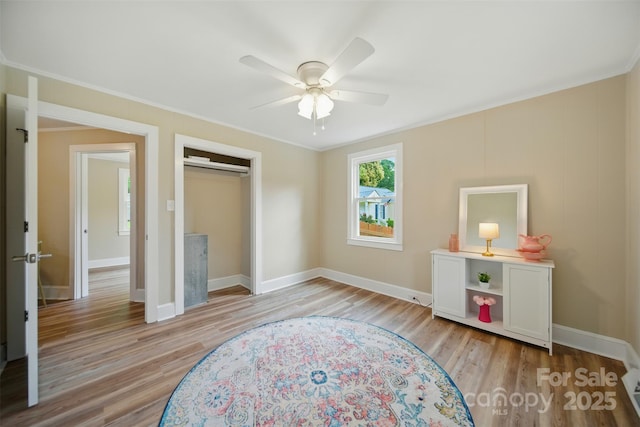407 Cummings St, Rock Hill, SC 29730 - unfurnished bedroom with light wood-style flooring, a closet, crown molding, and a ceiling fan