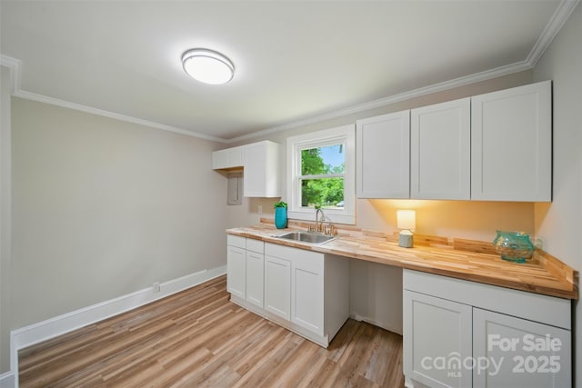 407 Cummings St, Rock Hill, SC 29730 - kitchen featuring wood counters, light wood-style flooring, white cabinets, and ornamental molding