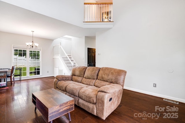 12 Eden Glen Rd, Black Mountain, NC 28711 - living room featuring a chandelier, stairway, and dark wood-style floors
