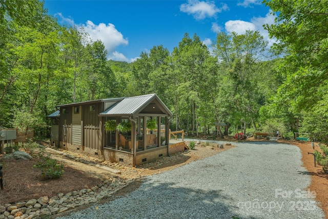 3095 Silversteen Rd, Lake Toxaway, NC 28747 - view of yard with gravel driveway and a wooded view