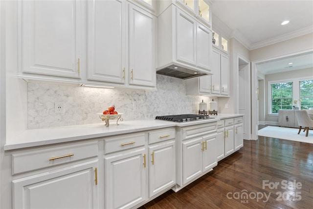 920 Terramore Dr, Waxhaw, NC 28173 - kitchen featuring stainless steel gas stovetop, crown molding, white cabinetry, light countertops, and dark wood finished floors