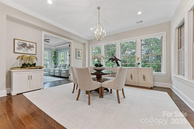 920 Terramore Dr, Waxhaw, NC 28173 - dining space with a chandelier, dark wood finished floors, ornamental molding, and recessed lighting