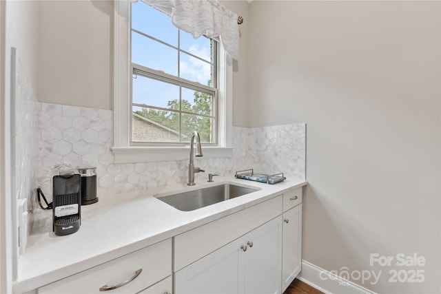 920 Terramore Dr, Waxhaw, NC 28173 - kitchen with white cabinetry, tasteful backsplash, and light countertops