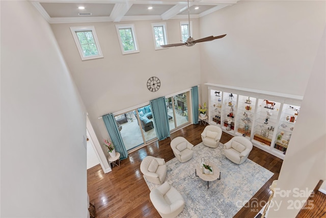 920 Terramore Dr, Waxhaw, NC 28173 - living room with healthy amount of natural light, a ceiling fan, a high ceiling, beamed ceiling, and wood finished floors