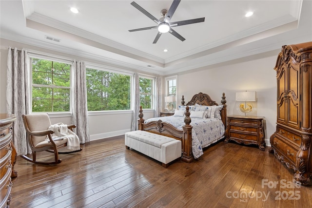 920 Terramore Dr, Waxhaw, NC 28173 - bedroom with a tray ceiling, dark wood-style flooring, ornamental molding, a ceiling fan, and recessed lighting