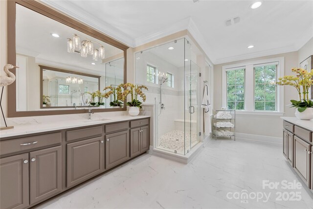 920 Terramore Dr, Waxhaw, NC 28173 - bathroom with ornamental molding, vanity, a stall shower, a chandelier, and recessed lighting