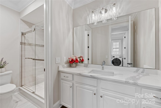 920 Terramore Dr, Waxhaw, NC 28173 - bathroom featuring washer / clothes dryer, a shower stall, vanity, and ornamental molding
