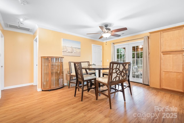 2279 Cedar Oak Cir, Gastonia, NC 28052 - dining room featuring ornamental molding, light wood-style flooring, ceiling fan, and french doors
