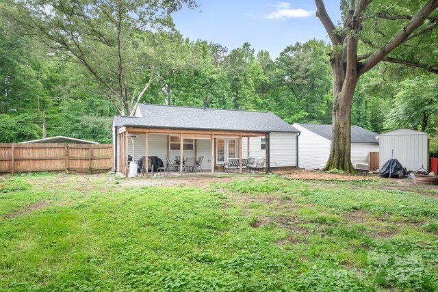 2279 Cedar Oak Cir, Gastonia, NC 28052 - rear view of house featuring a patio, a shed, and french doors
