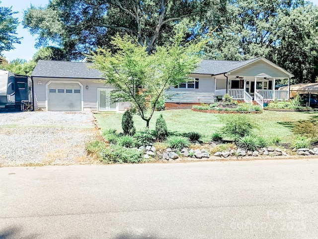 2279 Cedar Oak Cir, Gastonia, NC 28052 - ranch-style house featuring an attached garage, covered porch, a front lawn, a ceiling fan, and driveway