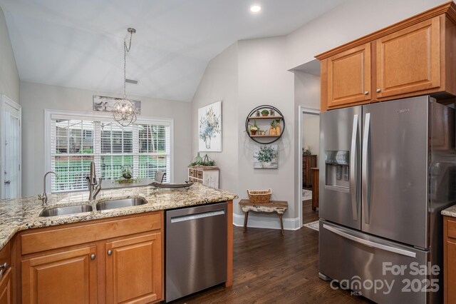 7988 Golf Course Dr N, Denver, NC 28037 - kitchen featuring appliances with stainless steel finishes, light stone countertops, dark wood-type flooring, vaulted ceiling, and a chandelier