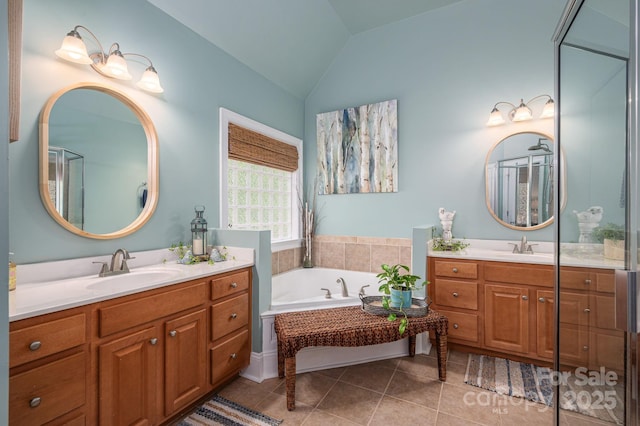 7988 Golf Course Dr N, Denver, NC 28037 - bathroom featuring two vanities, tile patterned flooring, a garden tub, and vaulted ceiling