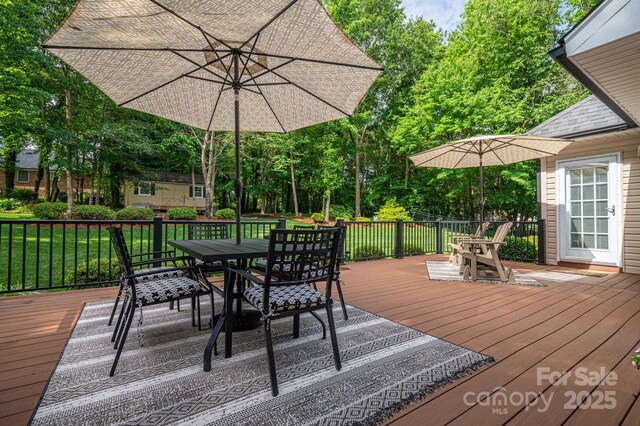 7988 Golf Course Dr N, Denver, NC 28037 - wooden deck with outdoor dining area, view of scattered trees, and a lawn
