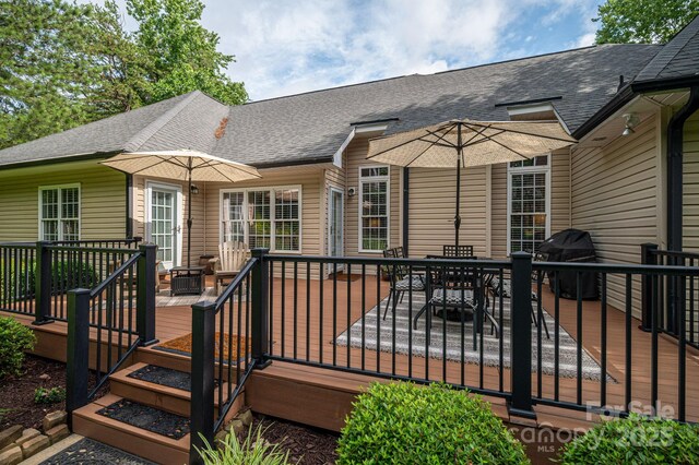 7988 Golf Course Dr N, Denver, NC 28037 - wooden deck with outdoor dining space and area for grilling