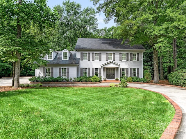 2141 Halford Pl, Charlotte, NC 28211 - colonial inspired home featuring a front yard and a shingled roof