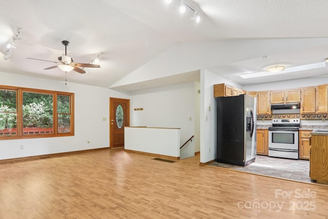 58 Oak Ter, Arden, NC 28704 - kitchen featuring stainless steel refrigerator with ice dispenser, white electric stove, track lighting, under cabinet range hood, and vaulted ceiling