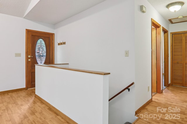 58 Oak Ter, Arden, NC 28704 - hallway featuring an upstairs landing and light wood-style floors