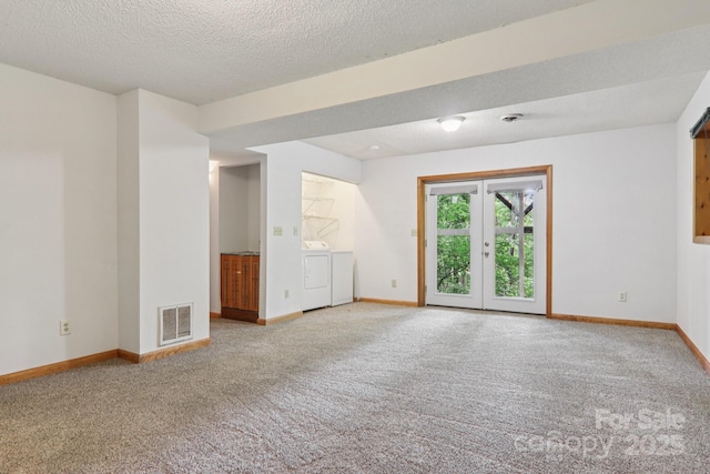 58 Oak Ter, Arden, NC 28704 - carpeted empty room with washing machine and clothes dryer, french doors, and a textured ceiling