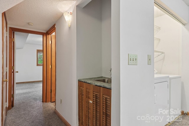 58 Oak Ter, Arden, NC 28704 - hallway with washing machine and dryer, carpet flooring, and a textured ceiling