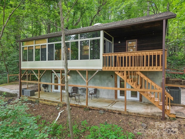 58 Oak Ter, Arden, NC 28704 - back of house featuring a sunroom, a patio area, and stairs