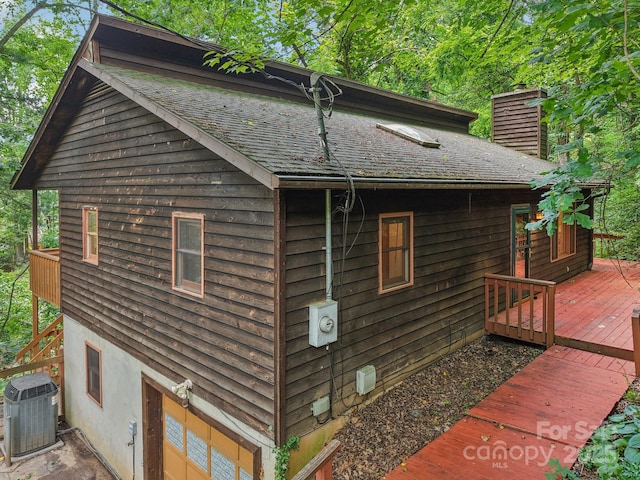 58 Oak Ter, Arden, NC 28704 - view of side of property with a wooden deck, a chimney, and roof with shingles