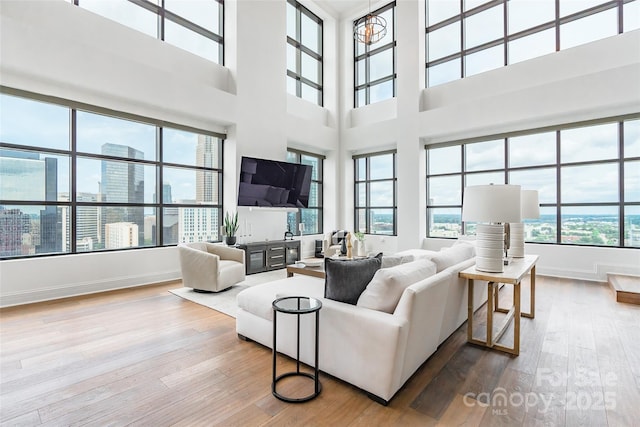 222 S Caldwell St # 2203, Charlotte, NC 28202 - living area featuring hardwood / wood-style flooring and a towering ceiling
