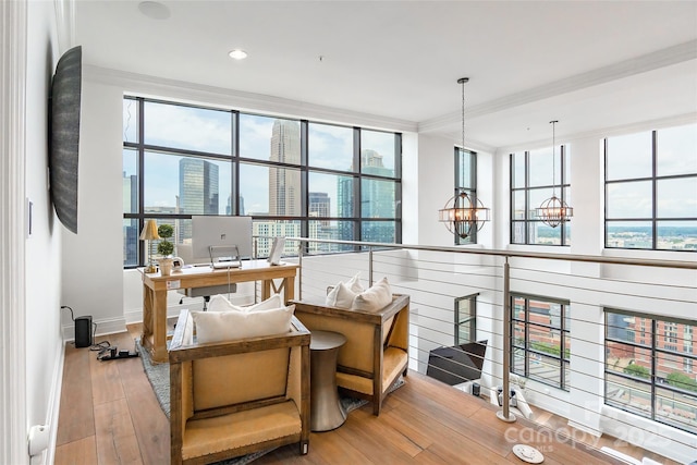 222 S Caldwell St # 2203, Charlotte, NC 28202 - dining space with crown molding, wood-type flooring, plenty of natural light, a desk, and a chandelier