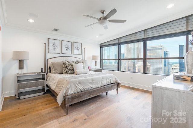 222 S Caldwell St # 2203, Charlotte, NC 28202 - bedroom with crown molding, light wood finished floors, lofted ceiling, ceiling fan, and recessed lighting