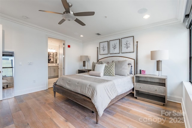 222 S Caldwell St # 2203, Charlotte, NC 28202 - bedroom featuring recessed lighting, wood finished floors, crown molding, connected bathroom, and ceiling fan