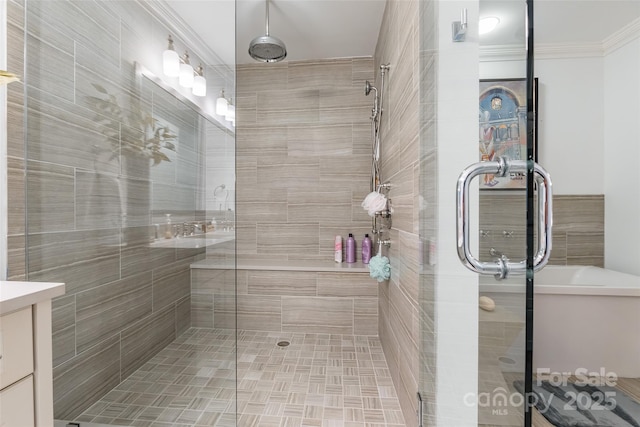 222 S Caldwell St # 2203, Charlotte, NC 28202 - full bathroom featuring a shower stall, crown molding, vanity, and tile walls