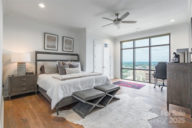 222 S Caldwell St # 2203, Charlotte, NC 28202 - bedroom featuring wood finished floors, ornamental molding, recessed lighting, and a ceiling fan