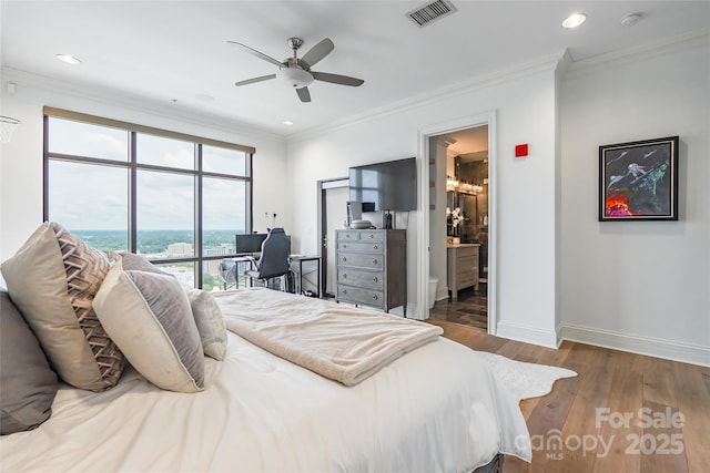 222 S Caldwell St # 2203, Charlotte, NC 28202 - bedroom with crown molding, wood-type flooring, recessed lighting, ensuite bath, and ceiling fan