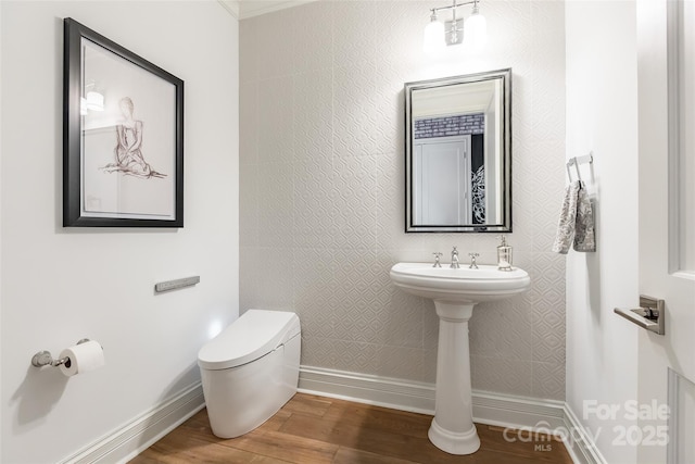 222 S Caldwell St # 2203, Charlotte, NC 28202 - half bathroom featuring wood finished floors and toilet