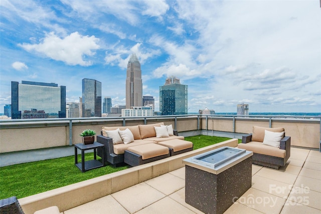 222 S Caldwell St # 2203, Charlotte, NC 28202 - patio / terrace with an outdoor living space with a fire pit, a skyline view, and a patio
