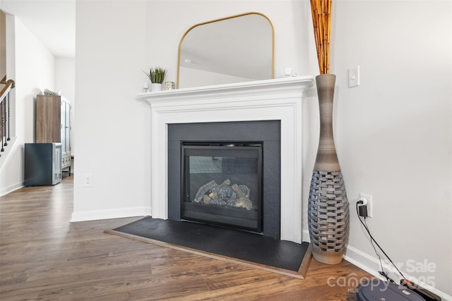 1343 Kent Downs Ave SW, Concord, NC 28027 - detailed view of wood finished floors and a glass covered fireplace