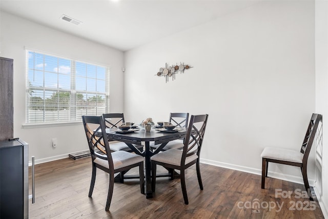 1343 Kent Downs Ave SW, Concord, NC 28027 - dining area featuring wood finished floors and baseboards