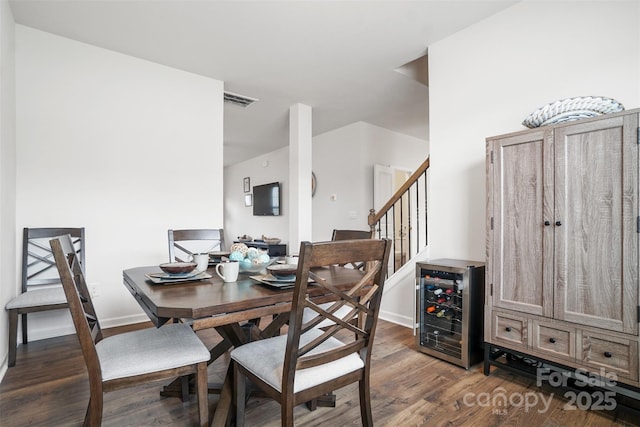 1343 Kent Downs Ave SW, Concord, NC 28027 - dining room featuring wine cooler, wood finished floors, and stairway