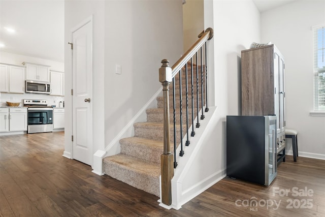 1343 Kent Downs Ave SW, Concord, NC 28027 - stairway with wood finished floors and recessed lighting