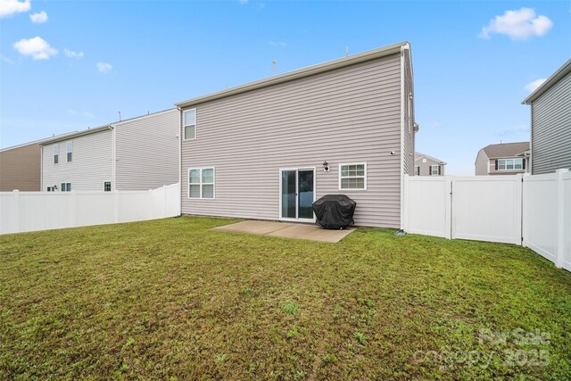 1343 Kent Downs Ave SW, Concord, NC 28027 - back of property with a patio area and a fenced backyard
