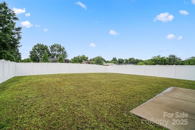 1343 Kent Downs Ave SW, Concord, NC 28027 - fenced backyard with a patio area