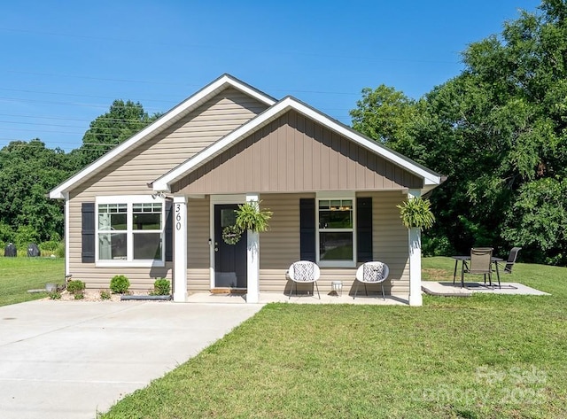 360 Sexton St, Kannapolis, NC 28081 - bungalow-style house featuring covered porch and a front lawn