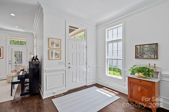 202 Caldwell Ln, Davidson, NC 28036 - entryway with ornamental molding, plenty of natural light, dark wood-style floors, a decorative wall, and wainscoting