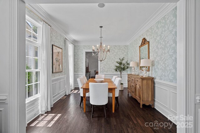 202 Caldwell Ln, Davidson, NC 28036 - dining room with a chandelier, wallpapered walls, dark wood-type flooring, wainscoting, and a decorative wall