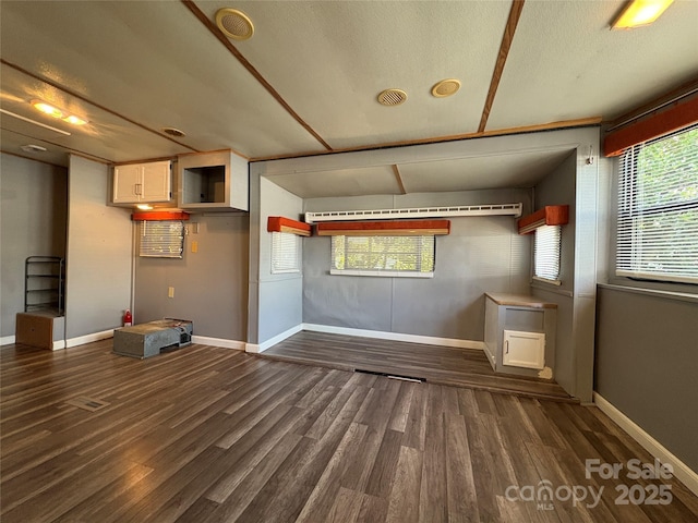 333 Mount View Ln Unit 266B, New London, NC 28127 - unfurnished living room with dark wood-style floors and baseboards
