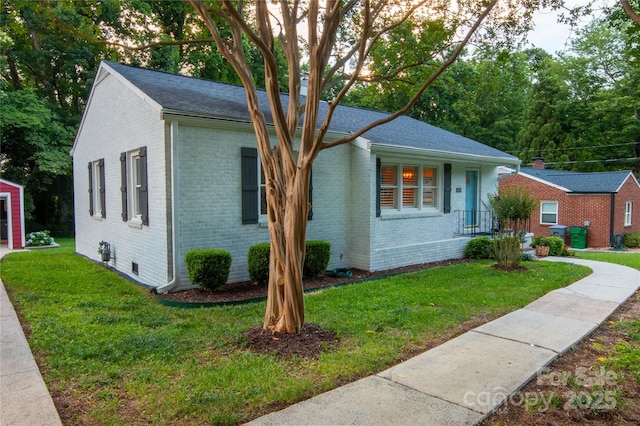 2115 Arnold Dr, Charlotte, NC 28205 - single story home with brick siding, a front yard, and crawl space