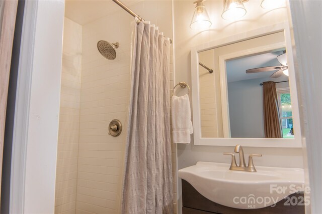 2115 Arnold Dr, Charlotte, NC 28205 - bathroom with vanity, tiled shower, and ceiling fan
