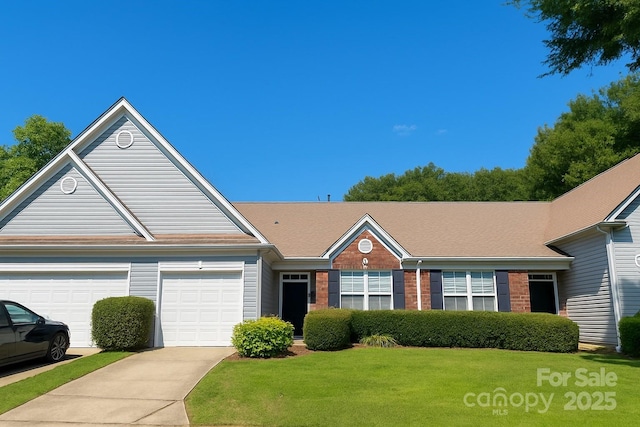 4454 Glenlea Commons Dr, Charlotte, NC 28216 - view of front facade featuring a front lawn, an attached garage, concrete driveway, and brick siding